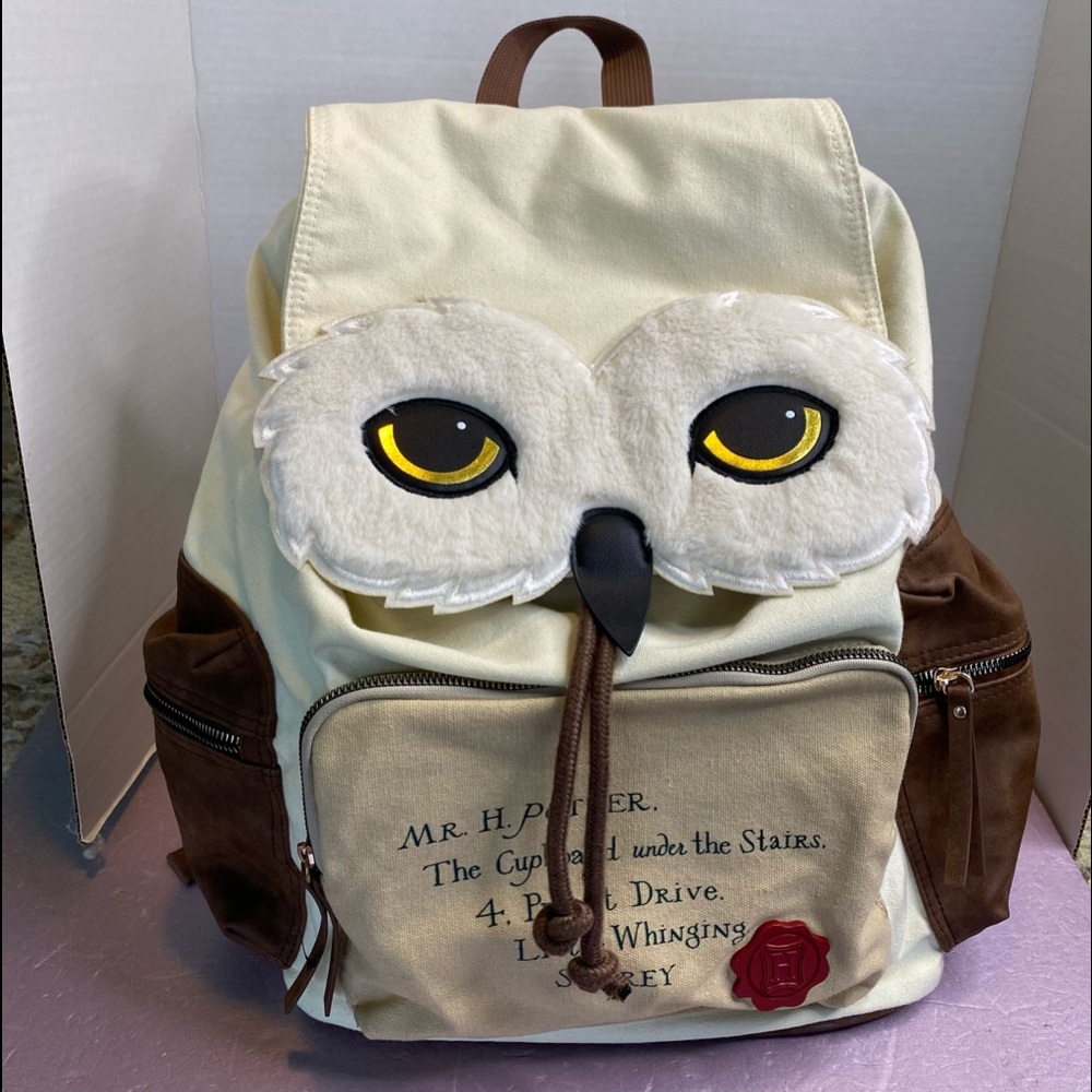 Mr H. Potter Owl backpack with draw string and magnet flap. Pre owned like new